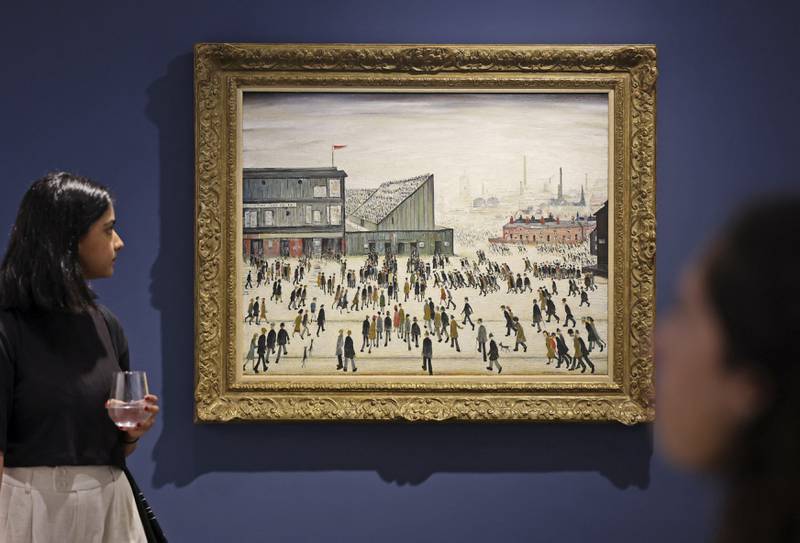 'Going to the Match' by LS Lowry from 1928, on display at a Christie's exhibition in Dubai. AFP