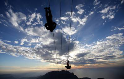 Thrill-seekers try out a new zipline, on the peak of Jebel Jais mountain, north east of Ras Al Khaimah. Kamran Jebreili / AP Photo