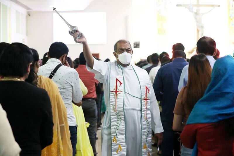 Father Lennie Connully during the Easter Sunday mass held at St. Mary's Catholic Church in Dubai. Pawan Singh / The National