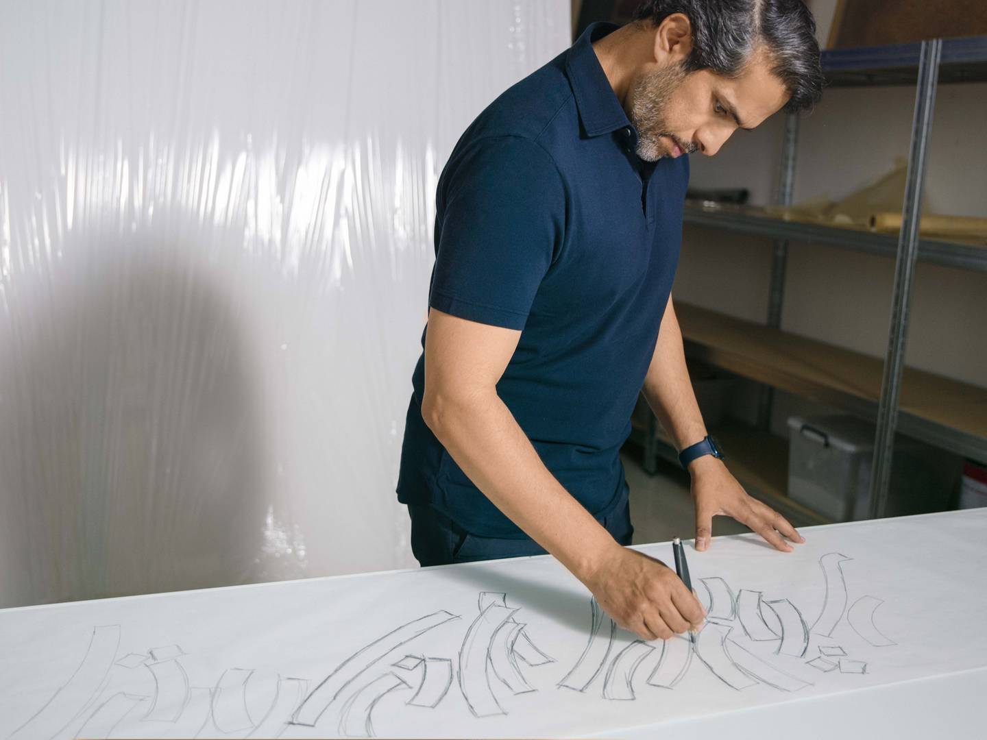 Mattar Bin Lahej is known for challenging the conventions of Arabic calligraphy, pushing the art form into the avant-garde. Photo: Loro Piana
