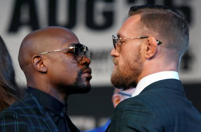 Undefeated boxer Floyd Mayweather Jr. (L) of the U.S. and UFC lightweight champion Conor McGregor of Ireland face off during a news conference in Las Vegas, Nevada U.S. on August 23, 2017. REUTERS/Las Vegas Sun/Steve Marcus