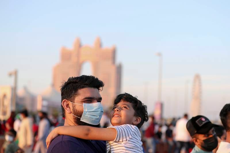 People soaking up the atmosphere on the Abu Dhabi Corniche on National Day.  Khushnum Bhandari/ The National