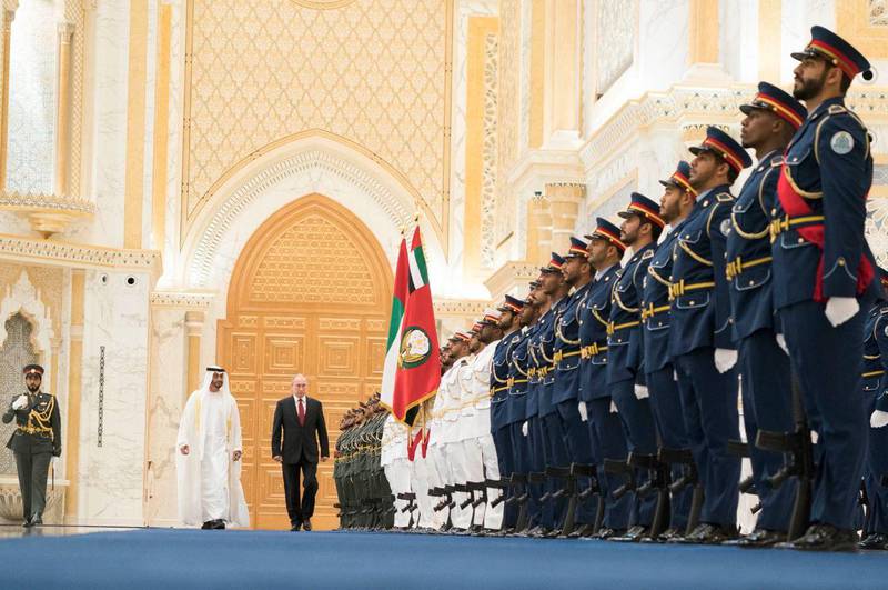 Sheikh Mohamed and Mr Putin observe an honour guard at Qasr Al Watan. Courtesy: Ministry of Presidential Affairs