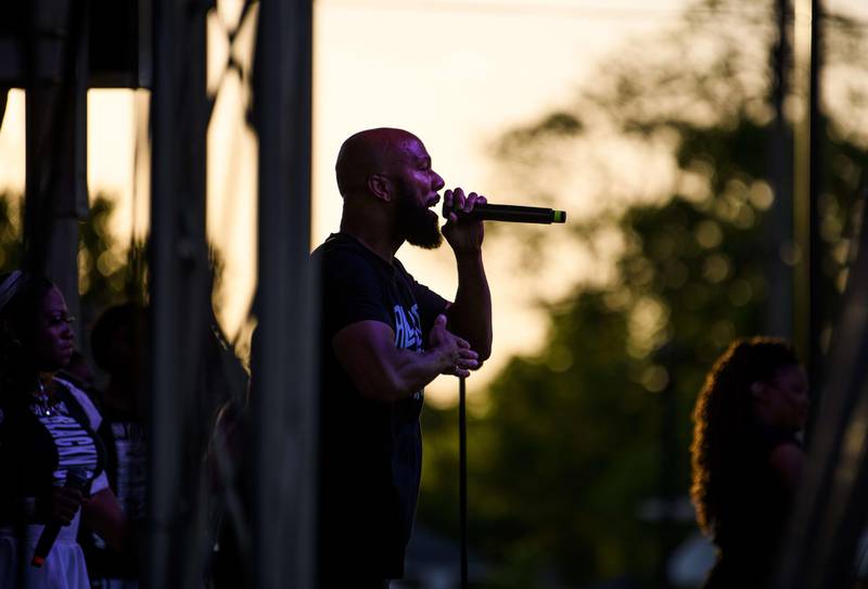 The musician Common performs with the Sounds of Blackness at George Floyd Square in Minneapolis, Minnesota. Floyd's death in May 2020 led to worldwide protests and calls for police reform or abolition. Getty
