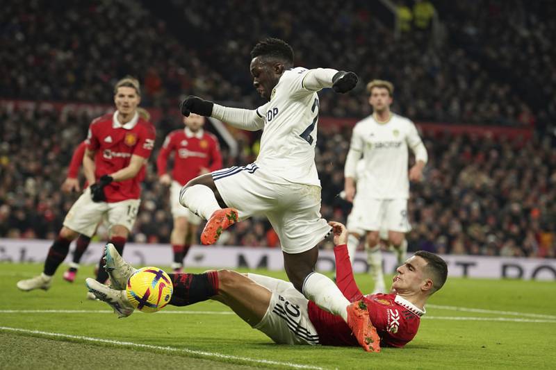 Leeds United's Wilfried Gnonto is tackled by Manchester United's Diogo Dalot. AP 