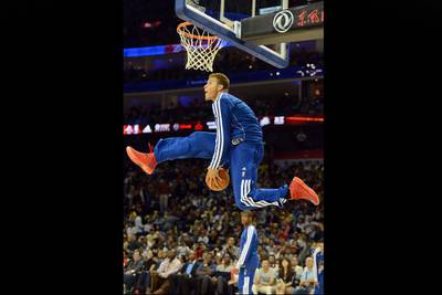 Blake Griffin of the Los Angeles Clippers prepares to dunk as he warms for a game against the Miami Heat in Shanghai, China. Mark Ralston / AFP Photo