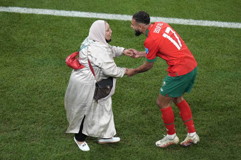 Morocco's Sofiane Boufal, right, celebrates with his mother after his team's win in the World Cup quarter-final against Portugal. AP