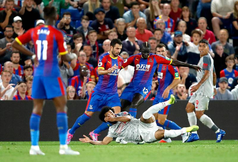 Liverpool forward Mohamed Salah falls to the ground to win his team a penalty against Crystal Palace. Getty Images