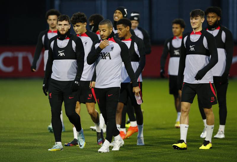 Liverpool's Thiago Alcantara and Andrew Robertson with teammates during training. Reuters
