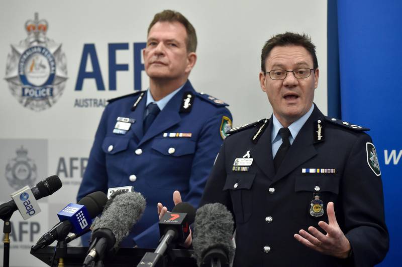 Australian Federal Police Deputy Commissioner Michael Phelan (R) speaks to the media beside New South Wales Police Deputy Commissioner David Hudson at a press conference in Sydney on August 4, 2017.
A senior Islamic State commander directed a group of Australian men to build a bomb destined for an Etihad Airways flight out of Sydney, with a second poisonous gas plot also in the works, police alleged on August 4. / AFP PHOTO / Peter PARKS