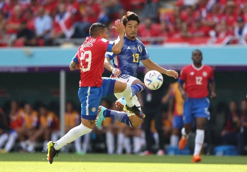 Morita and Torres tussle for possession in the early stages of the vital Group E encounter. Getty Images