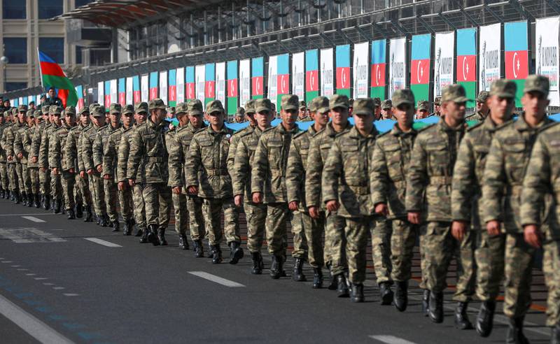 Azerbaijani soldiers take part in a procession marking the anniversary of the end of the 2020 military conflict over the Nagorno-Karabakh breakaway region, involving Azerbaijan's troops and ethnic Armenian forces, in Baku this month. Reuters