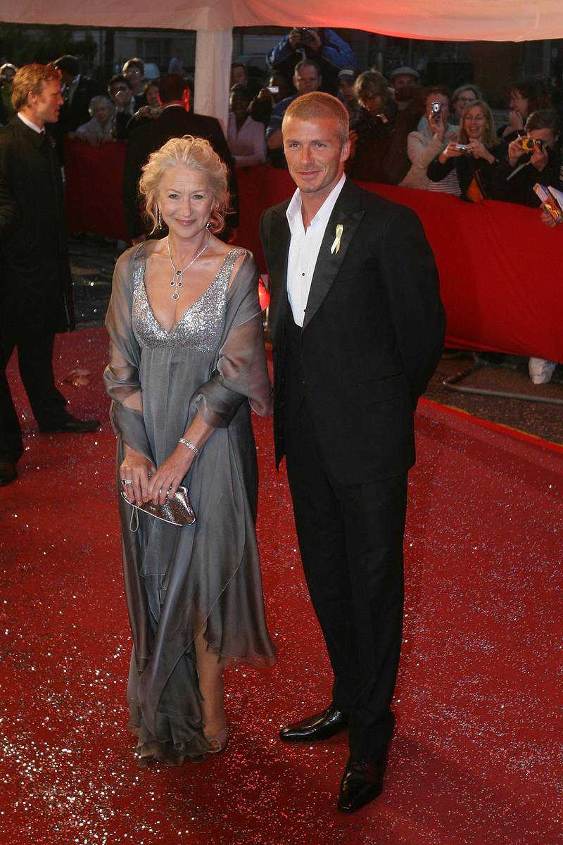 LONDON - MAY 21:  Dame Helen Mirren and David Beckham arrive at the Great Britons 2007 awards at London Television Studios on May 21, 2007 in London, England.  (Photo by Ben Stansall/Getty Images)