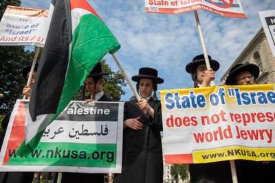 Members of Neturei Karta, who describe themselves as a group of Orthodox Jews against zionism, protest outside the White House last August. AP Photo