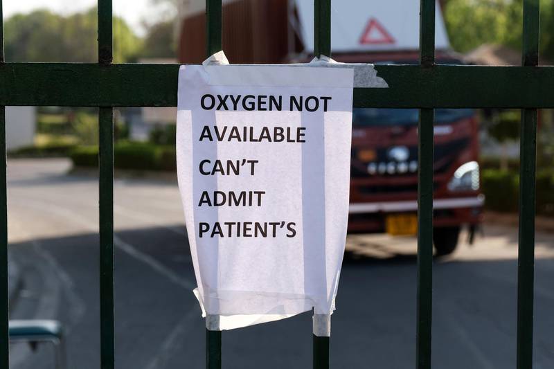 A sign indicates unavailability of oxygen at the Covid-19 care centre set up at the Commonwealth Games Village Sports Complex in New Delhi. Bloomberg