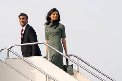 UK Prime Minister Rishi Sunak and his wife Akshata Murty board a plane in Tokyo on their way to Hiroshima. AFP