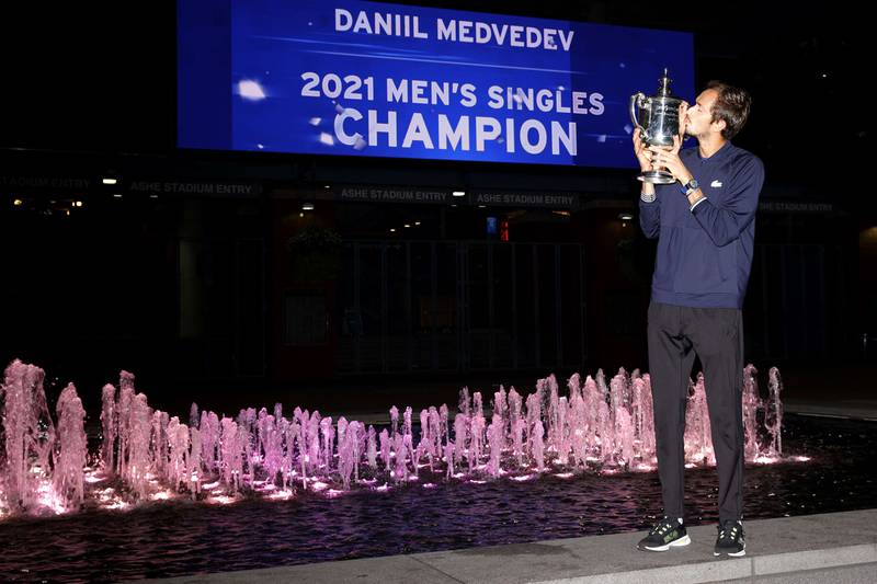Daniil Medvedev of Russia celebrates with the championship trophy. AFP