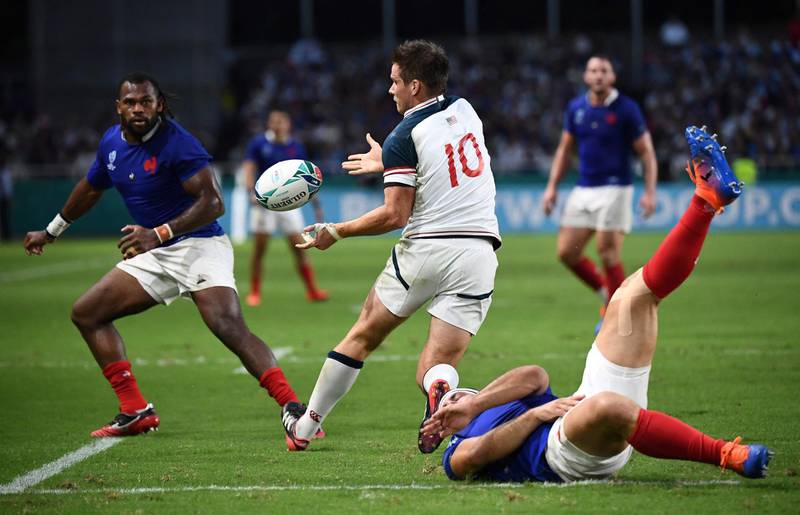 US fly-half AJ MacGinty (C) passes the ball  during the Japan 2019 Rugby World Cup Pool C match between France and the United States at the Fukuoka Hakatanomori Stadium in Fukuoka. AFP