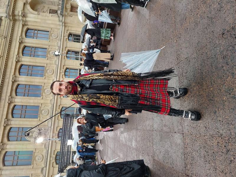 A kilt and an umbrella, in the rain at the Givenchy show.