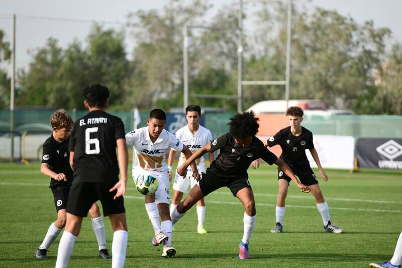Dubai City (in black) in action against Pumas Unam at the Mina Cup 2022 youth football tournament.