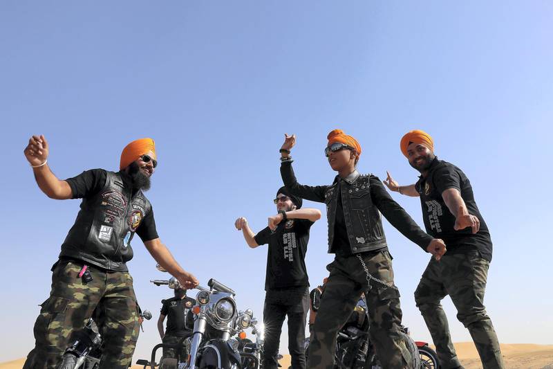 DUBAI ,  UNITED ARAB EMIRATES , May 17 – 2019 :- Members of the SMC ( Singhs Motorcycle Club UAE ) dancing on a Punjabi Folk dance called ‘Bhangra’ during the morning bike ride in Dubai. They are into charity events also. This Club was founded by Gurnam Singh and Tanuj Singh in 2014. They ride every Friday morning in different parts of the UAE. ( Pawan Singh / The National ) For Arts&Culture/Big Picture/Instagram/Online. Story by Kate