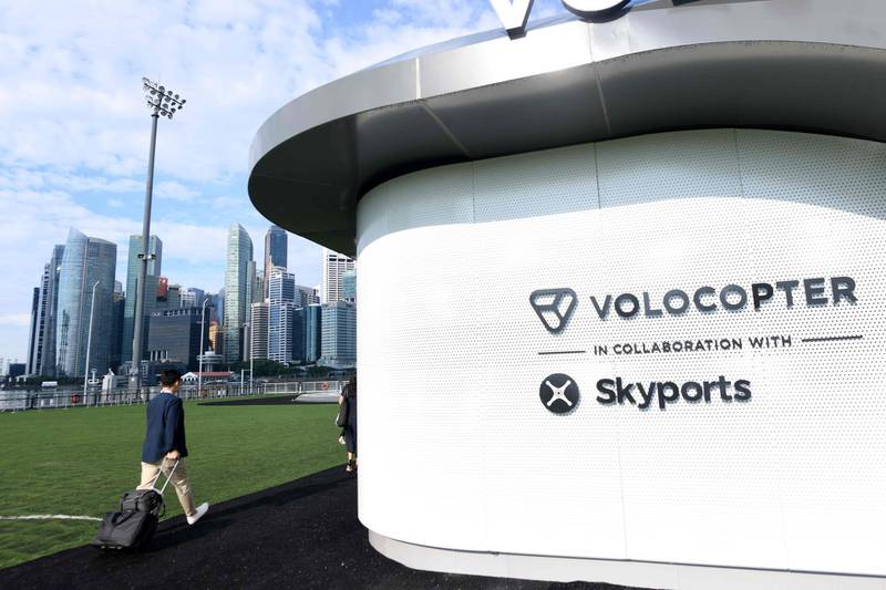 A visitor walks towards the prototype VoloPort in Marina Bay ahead of the Volocopter unmanned air taxi transport test flight during the 26th Intelligent Transport Systems World Congress (ITSWC) in Singapore.  AFP