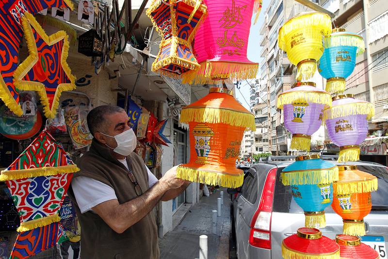 A man checks Ramadan decorations ahead of the Muslim holy month of Ramadan at a shop during a countrywide lockdown over the coronavirus disease (COVID-19) in Beirut, Lebanon April 17, 2020. Picture taken April 17, 2020. REUTERS/Mohamed Azakir