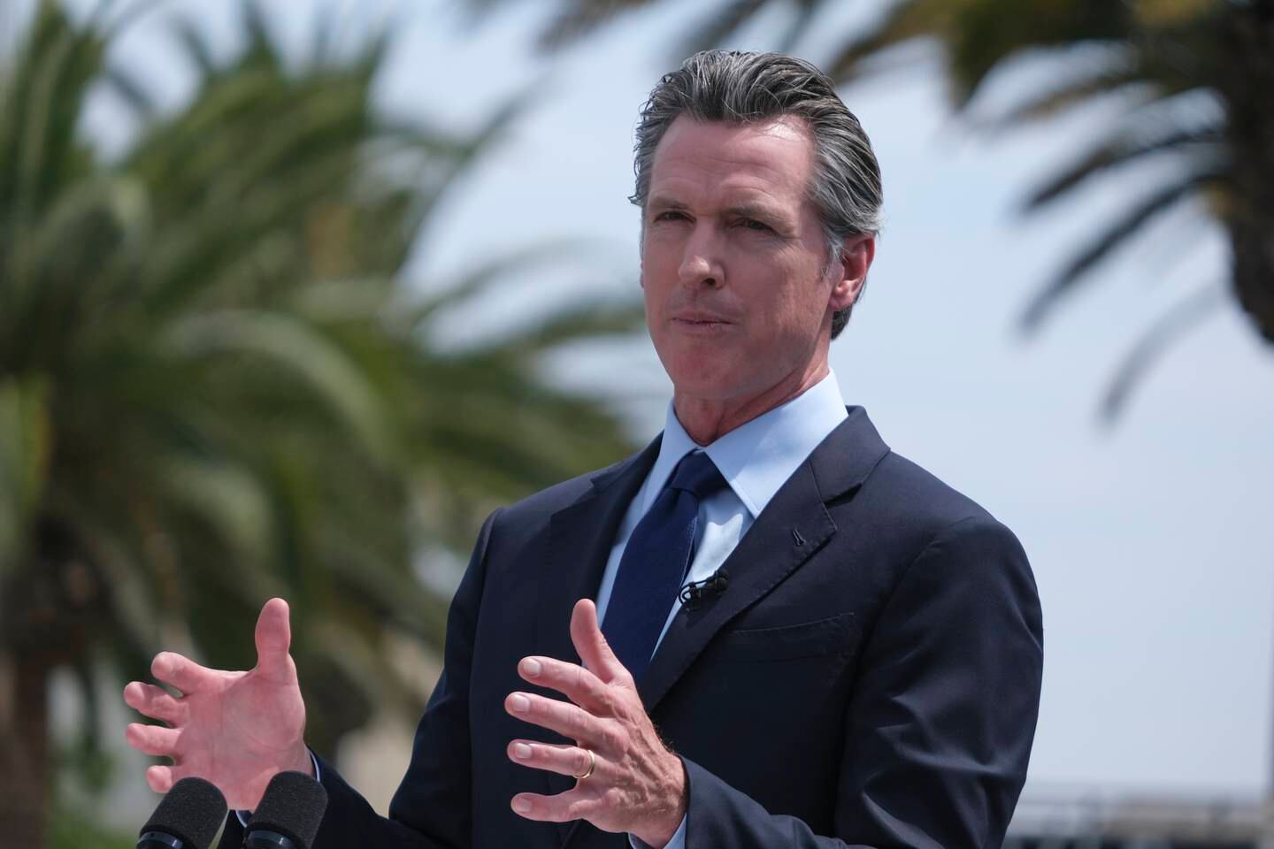 File photo of California Governor Gavin Newsom at a press conference in June. His mandate follows a similar move in New York. AP 