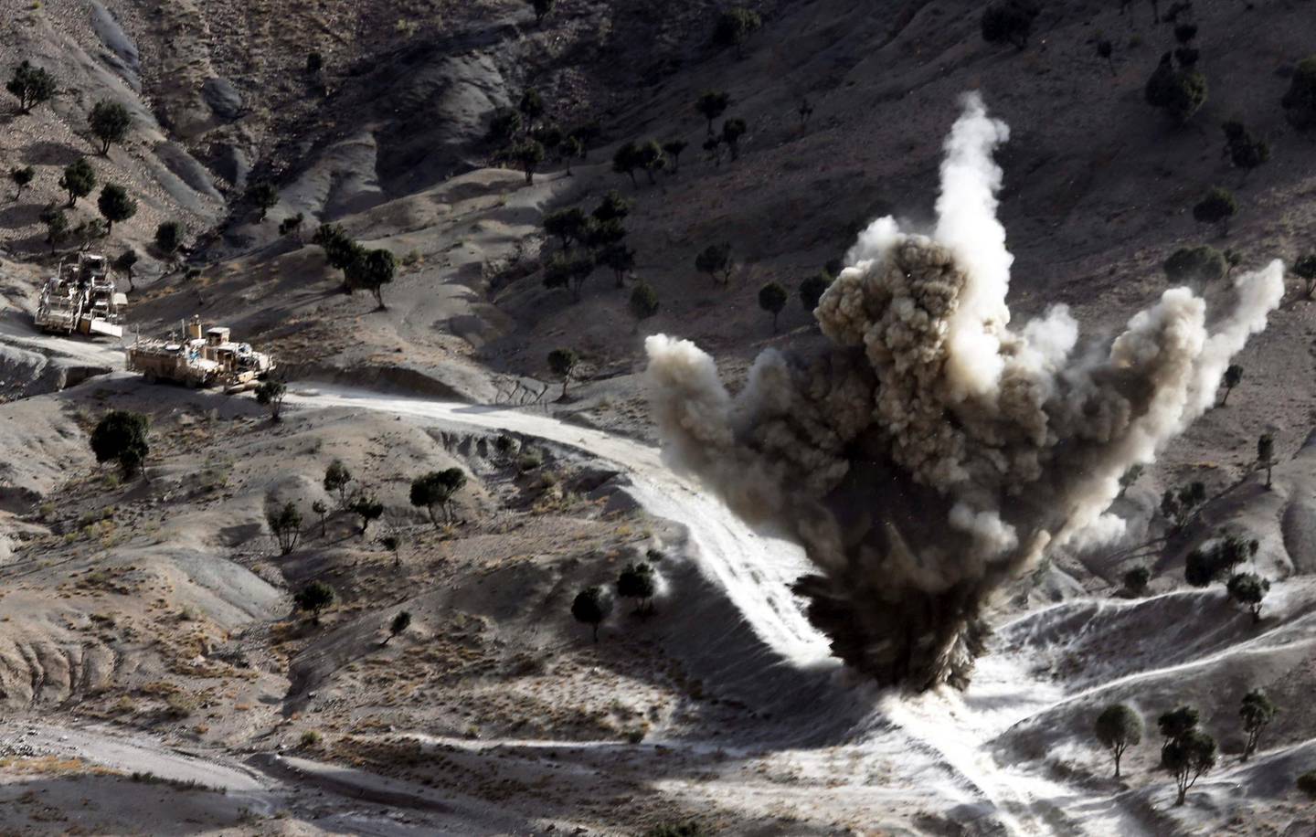 FILE PHOTO: U.S soldiers blow up a roadside bomb set up by Taliban fighters near the town of Walli Was in Paktika province, Afghanistan, near the border with Pakistan, November 4, 2012.   REUTERS/Goran Tomasevic/File Photo