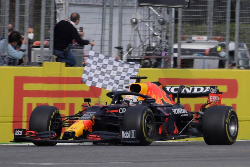 Red Bull driver Max Verstappen crosses the finish line to win the Emilia Romagna Grand Prix at the Imola racetrack in Italy on Sunday, April 18, 2021. AP