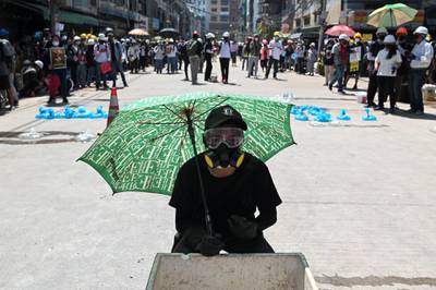A demonstrator holds an umbrella during a protest against the military coup in Yangon, Myanmar. Reuters