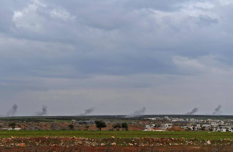 Smoke from Turkish artillery fire near the northern Syrian city of Afrin. George Ourfalian / AFP