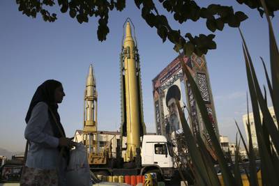 A Ghadr-H missile and a portrait of the supreme leader Ayatollah Ali Khamenei are on display for the annual Defence Week in Iran. AP