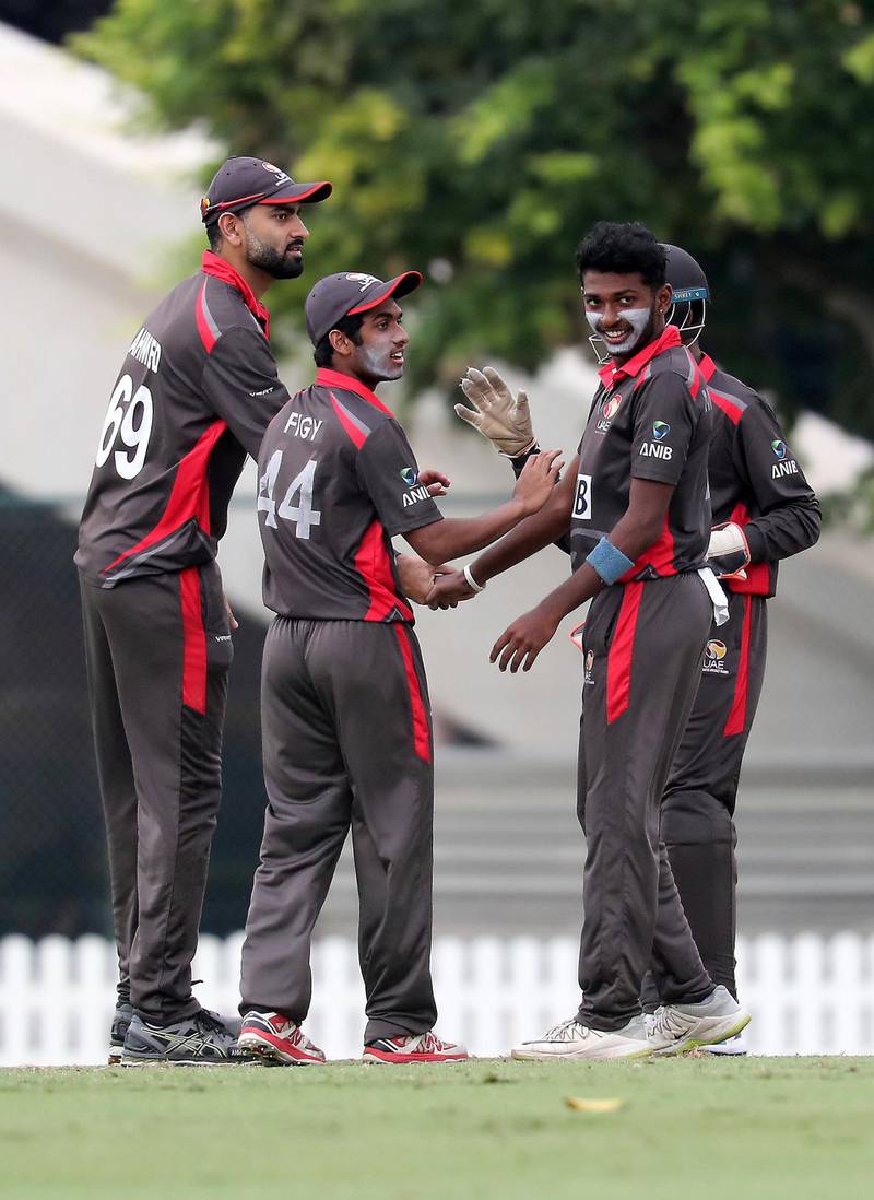DUBAI, UNITED ARAB EMIRATES , Dec 15– 2019 :- Palaniapan Meiyappan (right) of UAE celebrating after taking the wicket of Kyle Coetzer during the World Cup League 2 cricket match between UAE vs Scotland held at ICC academy in Dubai. He took 2 wickets in this match. ( Pawan Singh / The National )  For Sports. Story by Paul