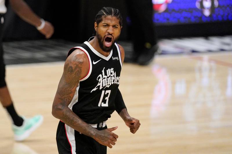 Los Angeles Clippers guard Paul George celebrates after scoring during the first half in Game 3 of the NBA basketball Western Conference Finals against the Phoenix Suns Thursday, June 24, 2021, in Los Angeles. (AP Photo/Mark J. Terrill)
