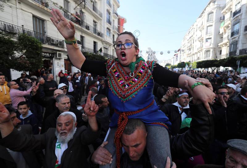 epa08237347 Algerians shout slogans as they march to mark the first anniversary of the popular protests in Algiers, Algeria, 22 February 2020. Algerian protesters this weekend are marking the first anniversary of the protest movement that began on 16 February 2019 after Abdelaziz Bouteflika announced his candidacy for a fifth presidential term. The protesters continue to press for their demands for a complete change of the ruling elite and an end to corruption.  EPA/MOHAMED MESSARA
