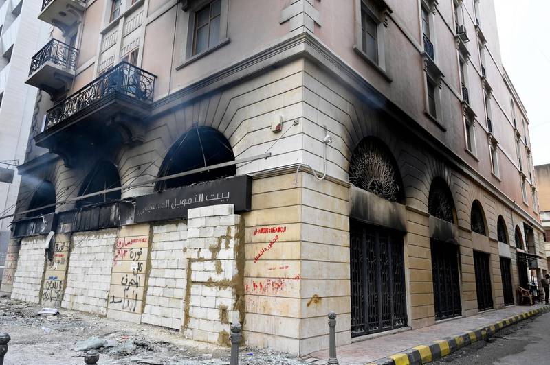 Exterior view of a damaged bank that was set ablaze by protesters in Tripoli, northern Lebanon.  EPA