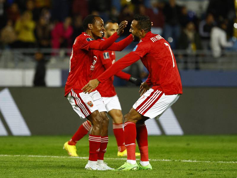Percy Tau celebrates with teammates after scoring Al Ahly's third goal. Reuters