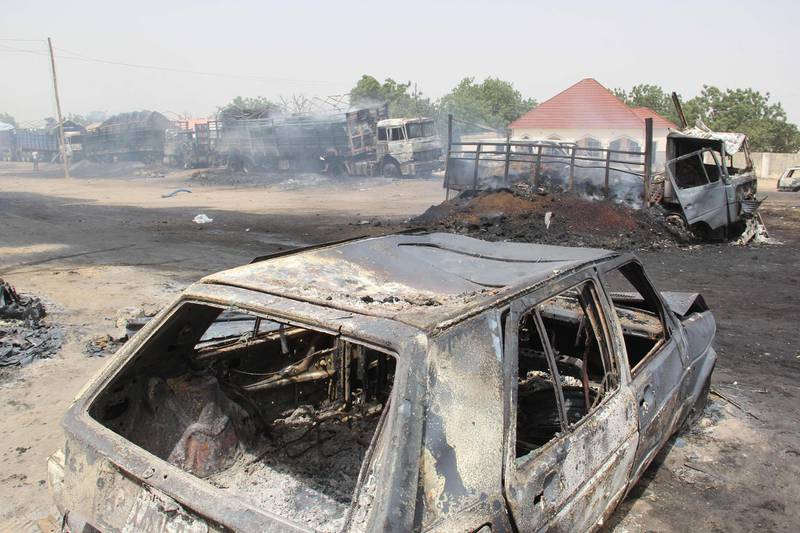In this photograph taken in Auno on February 10, 2020, cars burnt down by suspected members of the Islamic State West Africa Province (ISWAP) during an attack on February 9, 2020, is seen. Jihadists killed at least 30 people and abducted women and children in a raid in northeast Nigeria's restive Borno state, a regional government spokesman said on February 10, 2020.
The attack on February 9, 2020 targeted the village of Auno where jihadists stormed in on trucks mounted with heavy weapons, killing, burning and looting before kidnapping women and children. / AFP / AUDU MARTE
