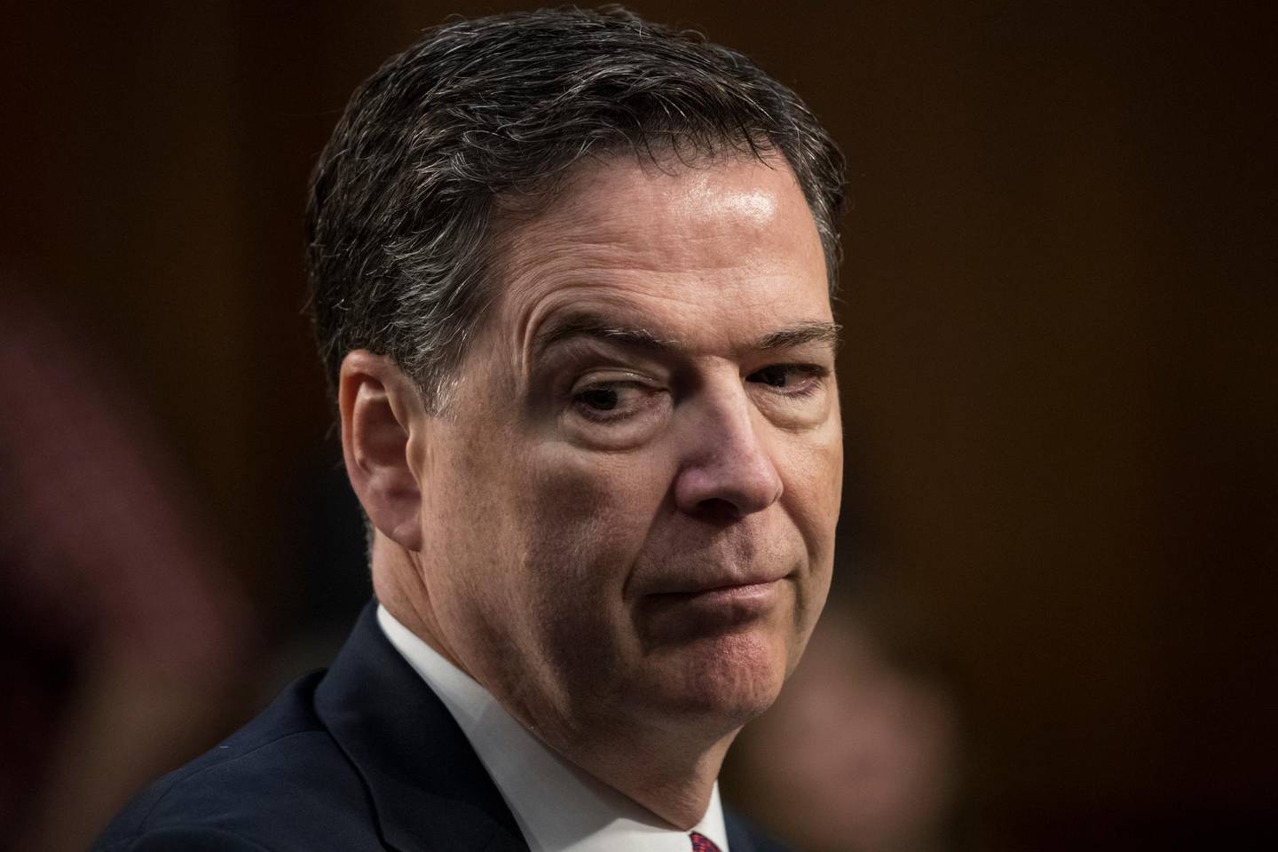 In this file photo, June 8, 2017, file photo, fired FBI director James Comey testifies before the Senate Select Committee on Intelligence, on Capitol Hill in Washington. The Justice Department's watchdog faults former Comey for breaking with protocol in his handling of the Hillary Clinton email investigation. But it says his decisions were not driven by political bias ahead of the 2016 election.(AP Photo/J. Scott Applewhite, File)