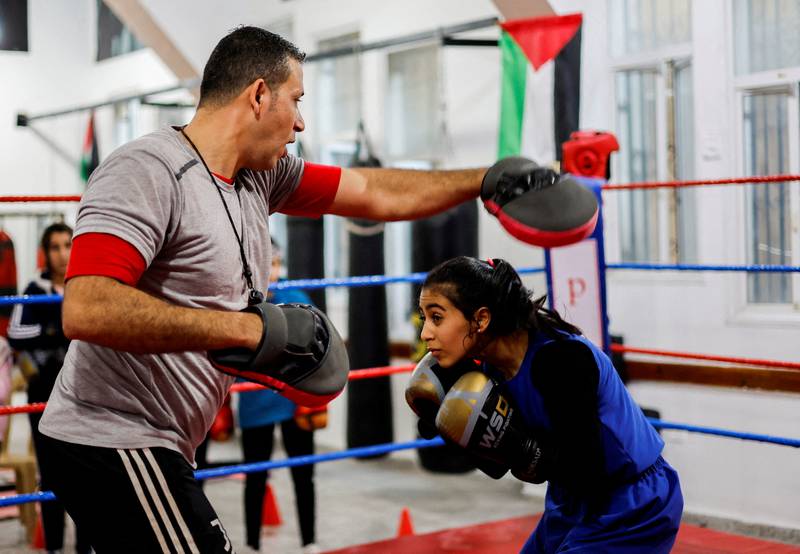 Palestinian Farah Abu Al Qomsan, 15, trains with coach Osama Ayoub at the first women's boxing gym in Gaza City on January 17. Reuters