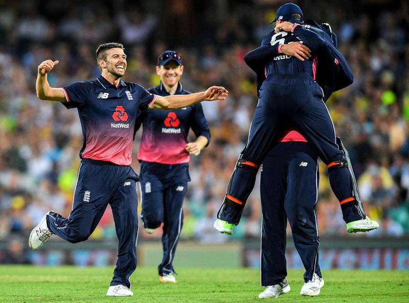 England's Mark Wood celebrates with team mates after dismissing Australia's Steve Smith during the one-day international match at the Sydney Cricket Ground in Sydney, Australia, January 21, 2018. AAP/Brendan Esposito/via REUTERS    ATTENTION EDITORS - THIS IMAGE WAS PROVIDED BY A THIRD PARTY. NO RESALES. NO ARCHIVE. AUSTRALIA OUT. NEW ZEALAND OUT.
