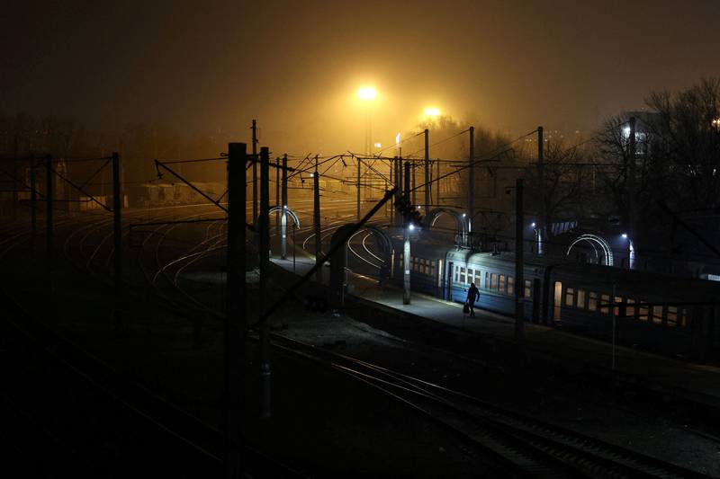 A local resident boards a train at a suburban area of Kiev. Reuters