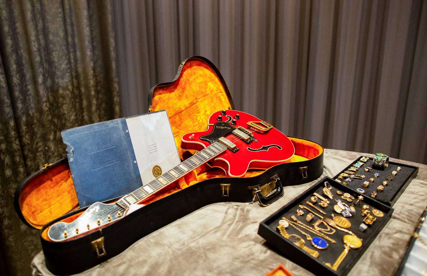 A guitar and a collection of personal jewelry of Elvis and former manager Colonel Tom Parker will be sold.  Photo: Aude Guerrucci / Reuters