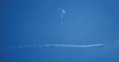 A jet flies by the balloon. Reuters