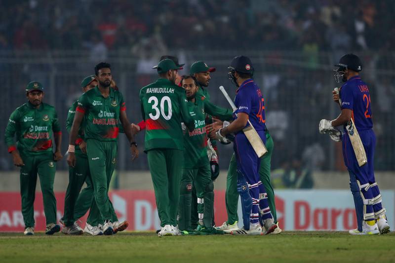 Indian captain Rohit Sharma, second right, congratulates Bangladesh players. AP
