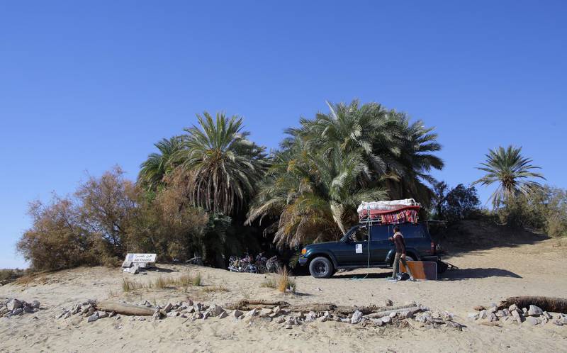A desert safari vehicle makes a stop next to Ain ElKhadra near the White Desert in Egypt. EPA