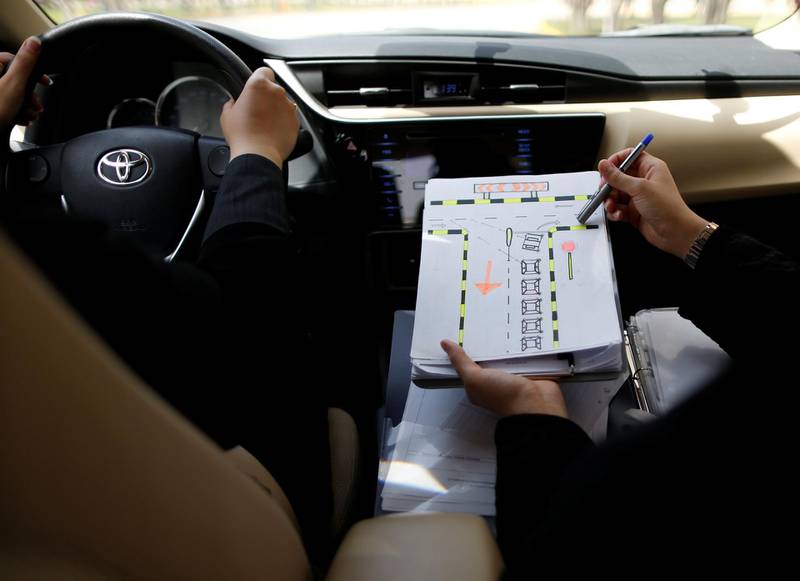 A driving instructor teaches how to negotiate a T-junction. Ahmed Jadallah / Reuters