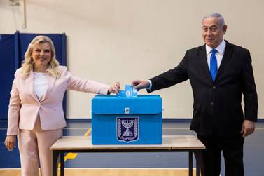 Israeli Prime Minister Benjamin Netanyahu and his wife Sara casts their votes during Israel's parliamentary election. Reuters