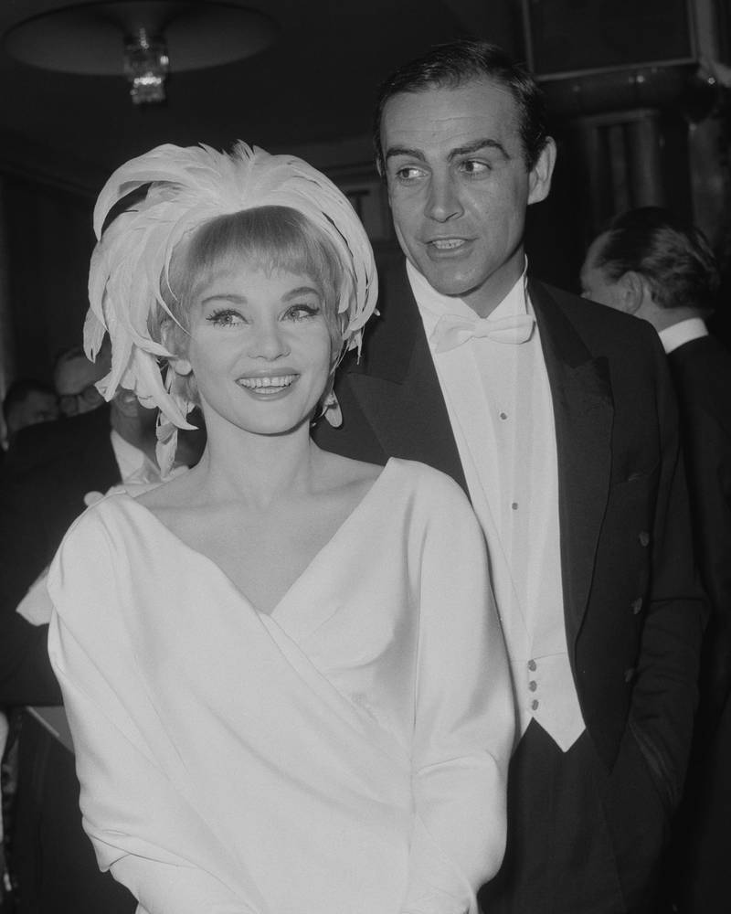 Scottish actor Sean Connery and his wife, actress Diane Cilento arrive at the Royal Film Performance of 'Lord Jim' at the Odeon Theatre, London, 15th February 1965. The film was screened in aid of the Cinema and Television Benevolent Fund. (Photo by Dennis Oulds/Central Press/Hulton Archive/Getty Images)